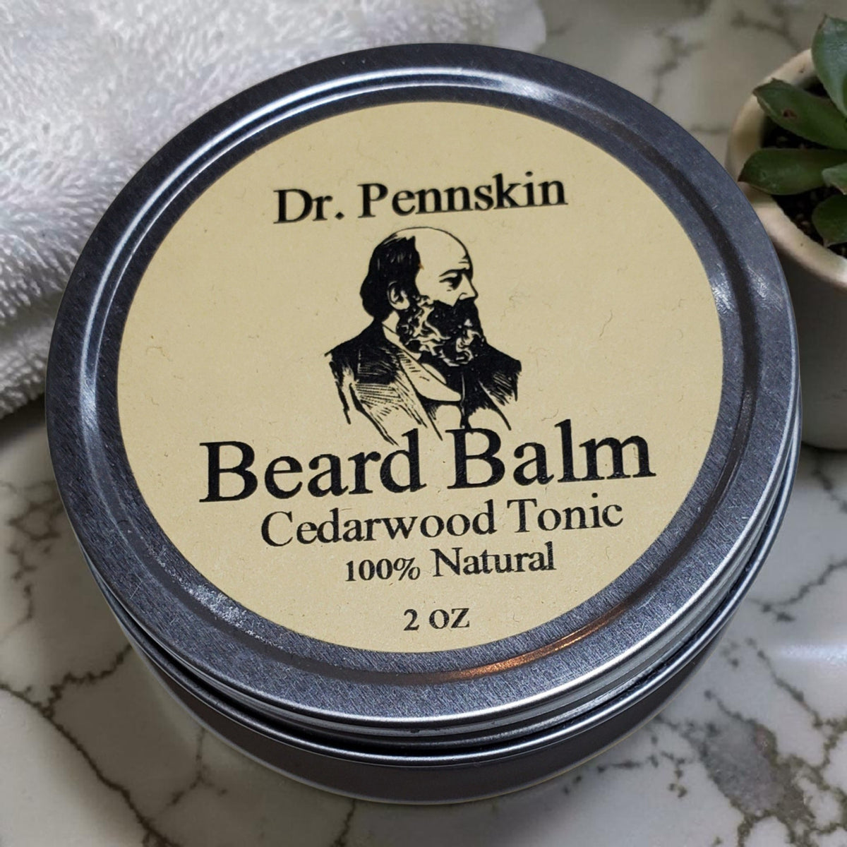 Dr. Pennskin natural beard balm in screw-top tin, made with beeswax and coconut oil